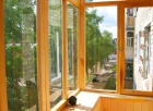 Остекление балкона окнами из лиственницы под ключ