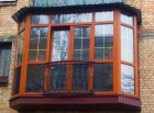 Остекление балкона окнами из дуба